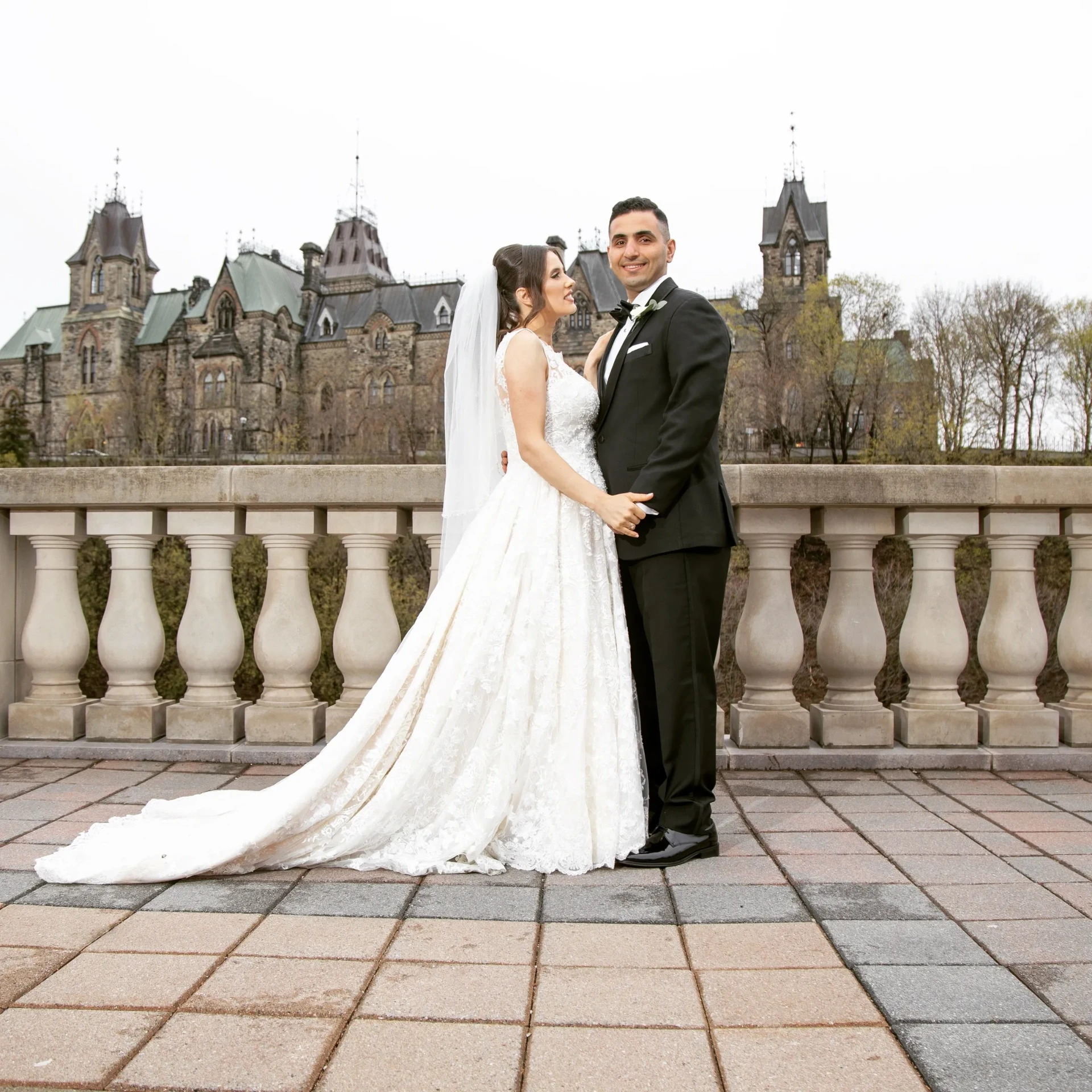 Bride and groom in front of Parliament in Ottawa